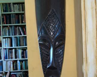 Hand-carved dark wood West African tribal mask