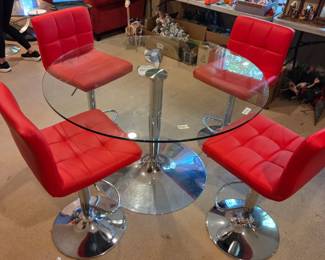 #121	Set of 4 Red Pleather and Chrome Base Swivel and Adjustable Bar Stools )  (adj. to max 30" Tall) with Foot Rest and Chrome Base and Calligaris Dining  Table w/Glass Top  and Round Chrome Base- 47x30 Table Size 	 $800.00 