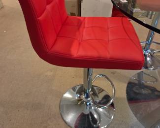 #121	Set of 4 Red Pleather and Chrome Base Swivel and Adjustable Bar Stools )  (adj. to max 30" Tall) with Foot Rest and Chrome Base and Calligaris Dining  Table w/Glass Top  and Round Chrome Base- 47x30 Table Size 	 $800.00 