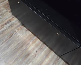 #107	Black Laminate TV Stand (as is missing handle) 60x19x23 	 $45.00 