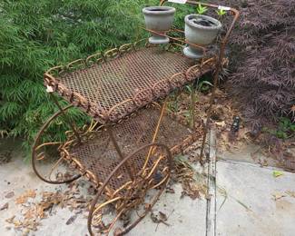 #204	Iron Rusty Tea Cart on 2 wheels - 27x17x33	 $35.00 