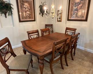 Dining table with eight chairs and leaf extension 