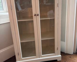 Glass front storage cabinet