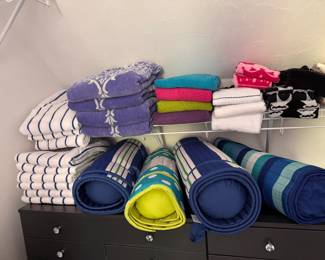 Beach mats, beach towels and other towels