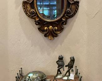 Antique wall mirror, ornate metal wall shelf