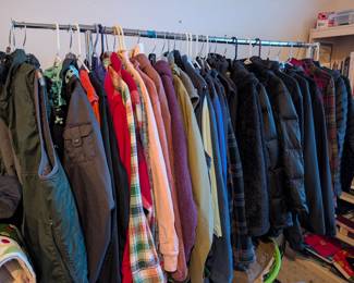 Rack with North Face, vintage flannels, Pacific Trail