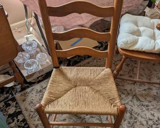 Four MCM ladder back rush seat chairs in nice condition