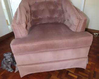 Dusty pink velvet swivel club chair.
