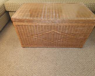 Wicker storage trunk/glass top coffee table.