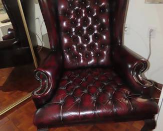 Tall back deep tufted leather reading chair.
