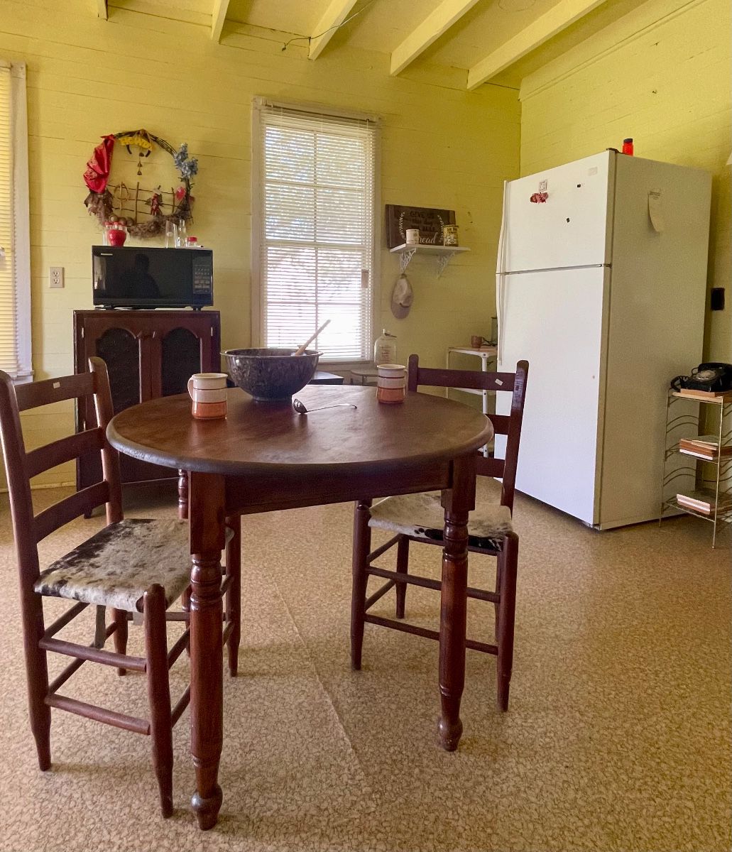 ANTIQUE TABLE, LADDER-BACK CHAIRS WITH HIDE SEATS