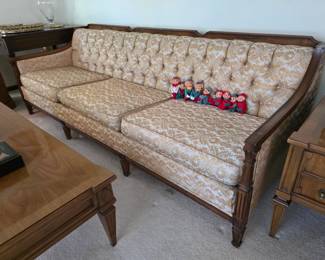 Gorgeous! vintage French Provincial style tufted sofa featuring a decorative carved walnut wood frame and cream-colored damask upholstery.