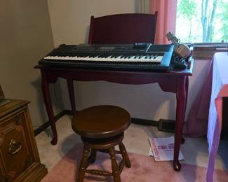 Beautiful wooden keyboard table and stool.