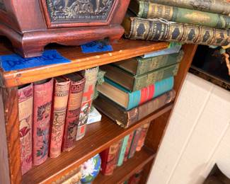 Antique Leather-Bound Books Ornate Spines Metal Relief Plaque Bookshelf