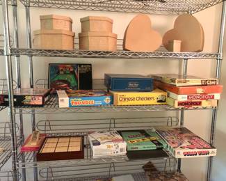 Identical chrome shelf- with board games & gift boxes