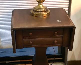 Brass lamp on antique Empire dropleaf sewing stand (20"W, 18"D, 29"H)