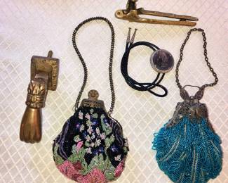 Brass door knocker, antique beaded purses, 1882 Morgan dollar bolo, brass squirrel nutcracker