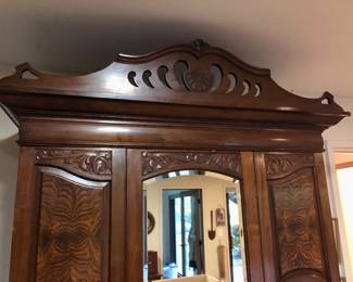 With carved details (cornice lifts off for transport)