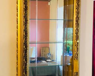 Wall mount gilt display cabinet, hinges on left (16”x35", interior glass shelves 3.25” deep)