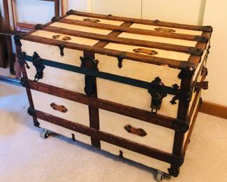Antique trunk on casters (35”L, 25”D, 25”H)