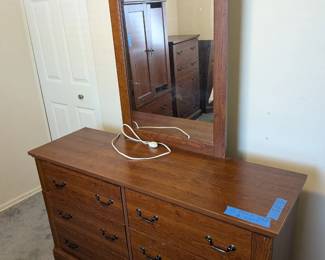 Matching 3-piece bedroom set with dresser, mirror, chest, and armoire, priced with broken door in mind.