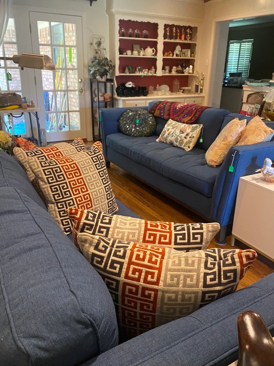 Living area with fabric couch, sofa, pillows, and more
