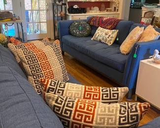 Living area with fabric couch, sofa, pillows, and more