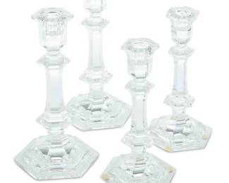 1389 Five pairs of Baccarat glass 'Harcourt' candlesticks Late 20th century Each with etched factory mark Comprising four taller and six shorter 10 pieces Each taller: 8.875" H x 4.5" W x 4.25" D; Each shorter: 7.875" H x 4.375" W x 3.75" D Estimate: $1,000 - $1,500