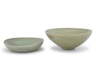 1035 Two Korean celadon ceramic dishes Goryeo Period (918-1392) or style Comprising one undecorated and one with incised floral motifs to interior 2 pieces Larger: 3" H x 7.5" Dia.; Smaller: 1.5" H x 6.375" Dia. Estimate: $800 - $1,200