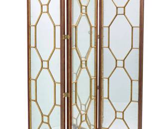 1386 A Chippendale style mirrored three panel floor screen Late 20th/early 21st century Possibly Lillian August, with brass hinges and faux astragal giltwood design over the antiqued mirror Each panel: 86.25" H x 22.5" W x 2" D; Stored: 6" D Estimate: $1,200 - $1,500