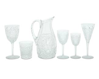 1317 A Baccarat glass 'Lagny' stemware service Late 20th century Each with etched factory mark Comprising: 10 tall water goblets (7.75") 10 claret wine glasses (6.5") 10 port wine glasses (5.75") 9 champagne flutes (8.125") 5 old fashioned (3.75") 1 water pitcher (10") 45 pieces Estimate: $1,200 - $1,800