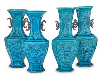 1032 Two pairs of Chinese turquoise glazed pottery archaistic vases Circa 1900 One pair depicting taotie masks, the other decorated with floral motifs and opposed bat-form handles 4 pieces Each floral: 10" H x 4.25" W x 3.125" D; Each taotie: 9.5" H x 4" W x 3" D Estimate: $800 - $1,200