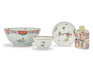 1029 An assembled group of Chinese Export Famille Rose porcelain Qianlong Period (1736-1795) or later Comprising a large bowl, a small dish, and a smaller bowl, each decorated with floral motifs, as well as a tea caddy decorated with a figural scene to each side 4 pieces Largest bowl: 3.875" H x 9" Dia.; Smaller bowl: 4.875" Dia.; Flask: 4.75" H x 3.375" W x 1.5" D Estimate: $800 - $1,200