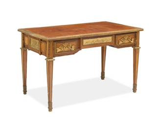 1302 A Louis XVI style gilt bronze mounted writing desk Paul Sormani (1817-1877), second half 19th century Lock marked: P. SORMANI With gilt-tooled leather top above gilt bronze trim, friezes depicting putti, and foliate drawer escutcheons, with two locking drawers and central spring-loaded drawer, each with later moiré lining 28.75" H x 45" W x 26.5" D Estimate: $3,000 - $4,000w
