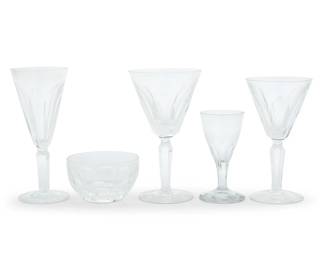 1388 A Waterford cut glass 'Sheila' part stemware service Late 20th century Designed 1958 Each etched with factory mark Comprising: 11 water goblets (7") 11 claret wine glasses (6.5") 27 fluted champagne glasses (7.125") 12 finger bowls (2.25") Together with 7 associated unmarked cordials (4.75") 68 pieces Estimate: $900 - $1,200