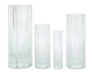 1341 Four Baccarat glass 'Harmonie' vases Late 20th century Each with etched factory mark In graduated sizes, the two largest housed in original boxes 4 pieces Largest: 11.75" H x 4.75" Dia.; Smallest: 7" H x 1.875" Dia.; Larger box: 8.25" H x 8.5" W x 16.25" D Estimate: $300 - $500