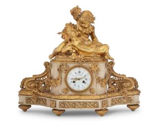 1307 A French gilt bronze figural mantel clock Late 19th century Marked to movement: 1093 / DENIERE / A PARIS / C. R. C. / C. R. Crookshank / 2261 / NS / CAILLEAUX Depicting putti at play above a Carrara marble base mounted with gilt-bronze garlands, ribbons, and scroll trim, centered by a white enamel dial with Roman hours and Arabic minutes, with two-train movement 16.5" H x 20" W x 6.625" D Estimate: $1,000 - $1,500