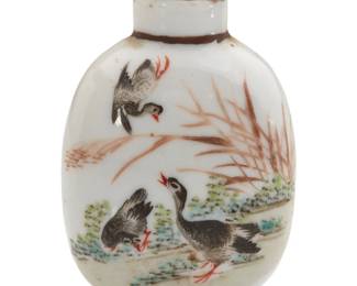 1132 A Chinese enameled porcelain snuff bottle 19th/20th century Unmarked Depicting waterfowl and reeds 2.625" H x 1.625" W x 1.125" D Estimate: $500 - $700