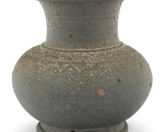 1034 A Korean black stoneware vessel Silla Dynasty (57 BCE-935 CE) With bands of incised decorations to shoulder and neck 5.375" H x 4.875" Dia. Estimate: $300 - $500