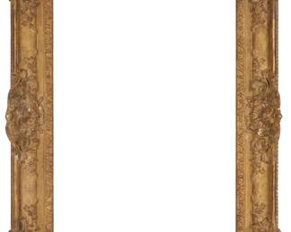 1371 A carved giltwood frame With foliate motifs in high relief Inner: 30" H x 22" W; Outer: 39" H x 31" W x 3" D Estimate: $400 - $600