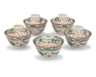 1023 A set of five Chinese polychrome porcelain rice bowls Early 20th century Bowls marked to underside and dishes marked on sticker: Made in China Comprising five rice bowls with covers, each decorated with dragons and flaming pearls 10 pieces Each sauce: 1.375" H x 3.875" Dia.; Each bowl: 2.375" H x 4.25" Dia. Estimate: $500 - $700