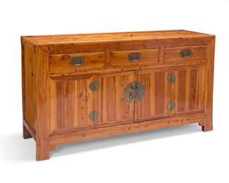 1012 A Chinese elmwood buffet Early 20th century With brass hardware and two drawers above cabinet doors opening to reveal a continuous compartment with single shelf 39" H x 68" W x 22" D Estimate: $400 - $600