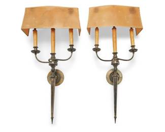 1312 A pair of silver plated wall sconces 20th century Each unmarked Each issuing three lights with faux candle fixtures, with thick paper shade, electrified 2 pieces Each: 28.5" H x 14.5" W x 5" D Estimate: $500 - $700