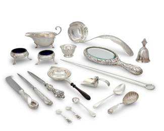 1237 A collection of silver articles Late 19th/20th century Most marked for sterling and maker Comprising an Alvin sauceboat, sugar castor, Tiffany bowl, pair of open salts with cobalt blue glass liners, bell, hand mirror, Tiffany cheese knife, letter openers, nut scoop, and various spoons, together with a silver-plated meat skewer 18 pieces Sauce boat: 3.25" H x 6.25" W x 3.625" D; Mirror: 10" L; Skewer: 14" L Total weighable silver: 21.3 gross oz. troy approximately Estimate: $1,200 - $1,800