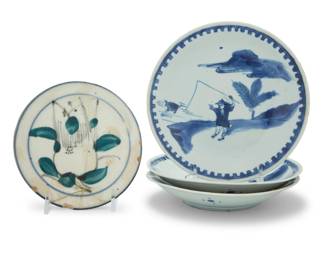 1036 Four Korean blue and white porcelain dishes Joseon Dynasty (1392-1910) Comprising three nearly matching, depicting a fisherman and a turtle, and one decorated with floral motifs 4 pieces Each Fisherman: 1.125" H x 6.5" Dia.; Floral: 0.875" H x 5.25" Dia. Estimate: $1,500 - $2,500