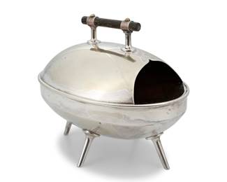 1107 Christopher Dresser (1834-1904) An electroplated silver spoon warmer, circa 1880 With impressed marks: H & H / 2693 Manufactured by Hukin & Heath, with ebonized wood handles 5.25" H x 6.5" W x 4.125" D Estimate: $400 - $600