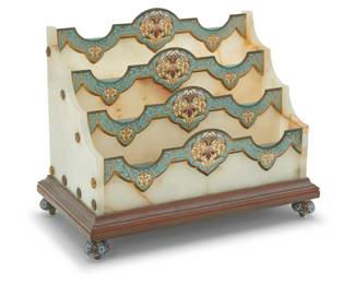 1301 A French champlevé and onyx letter rack Late 19th/early 20th century Unmarked With enameled floral decorations mounted to onyx, raised on a brass base with champlevé feet 9.5" H x 11.5" W x 6.625" D Estimate: $700 - $900