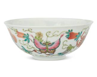 1022 A Chinese enameled porcelain bowl First half 20th century Bearing red painted reign mark for Qianlong Period (1736-1795); stamped: CHINA Depicting butterflies and flowers 2.625" H x 6.375" Dia. Estimate: $500 - $700