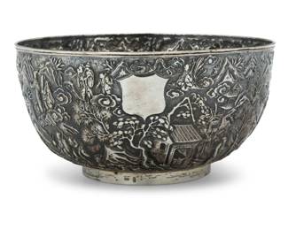 1003 A Woshing Chinese Export silver bowl Circa 1890s Impressed: WS / [Shanghai] The .900 silver bowl with repoussé wrap-around landscape depicting figural tableaus, with a blank shield cartouche 4.625" H x 9" Dia. 28.5 oz. troy approximately Estimate: $2,000 - $3,000