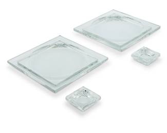 1392 A set of Baccarat glass 'Josephine Baker' plates and salt cellars Late 20th/early 21st century Designed by Georges Chevalier (1882-1967) Each with etched factory mark Comprising 12 dinner plates and 20 salt cellars 32 pieces Each plate:8.375" W x 8.375" D; Each cellar: 2.5" W x 2.5" D Estimate: $600 - $800